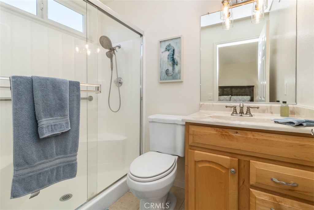 27432 Pinavete Mission Viejo, CA 92691 - Photo 23 of 37 a bathroom with a granite countertop sink toilet and shower