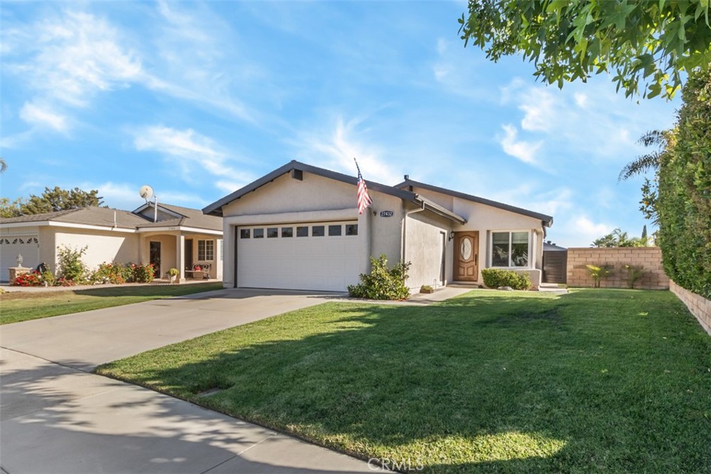 27432 Pinavete Mission Viejo, CA 92691 - Photo 4 of 37 a front view of a house with a yard and garage