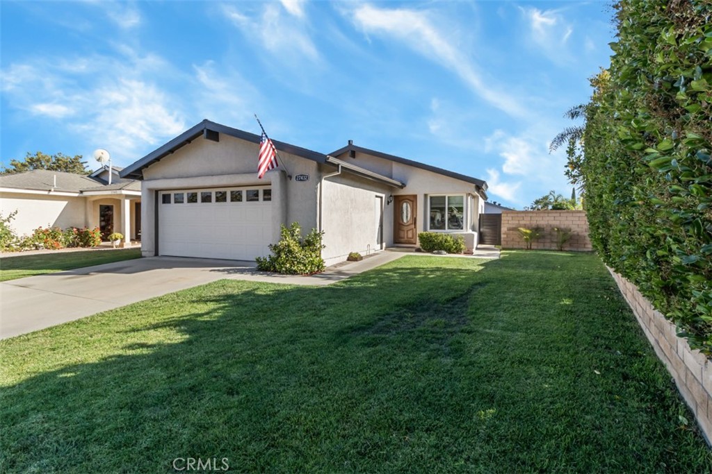 27432 Pinavete Mission Viejo, CA 92691 - Photo 5 of 37 a front view of a house with a yard and trees