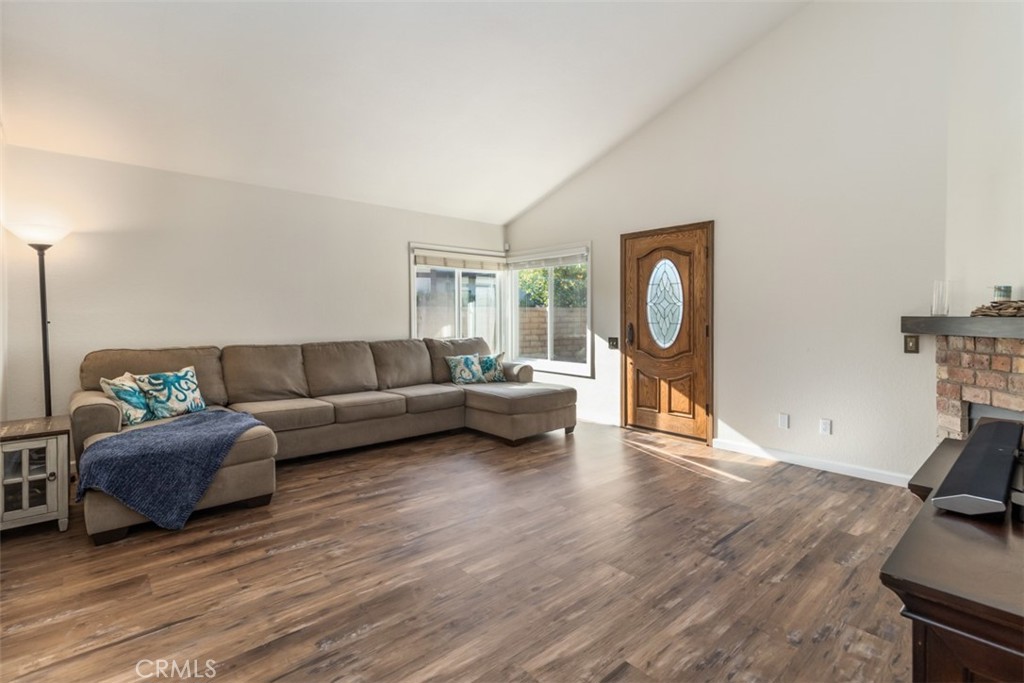 27432 Pinavete Mission Viejo, CA 92691 - Photo 8 of 37 a living room with furniture a mirror and a wooden floor