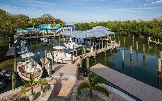 a view of a lake with a table and chairs