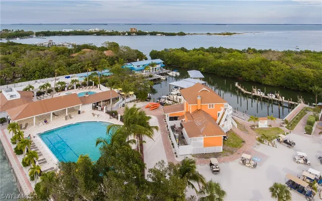 an aerial view of residential house with outdoor space and lake view
