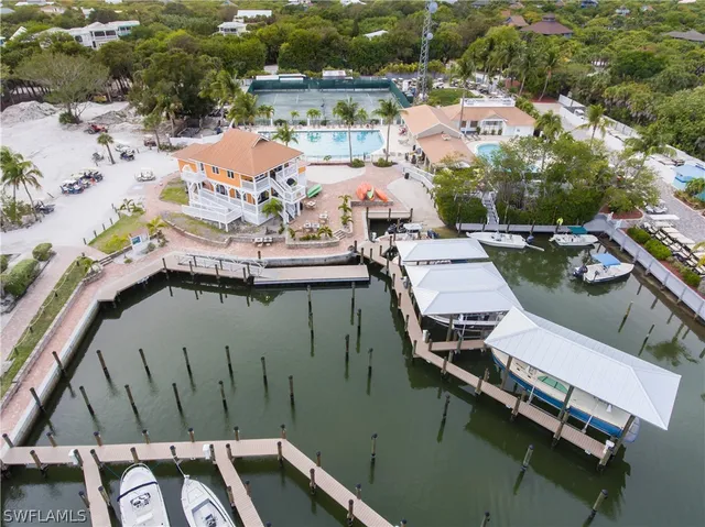 an aerial view of a house with pool patio and outdoor seating