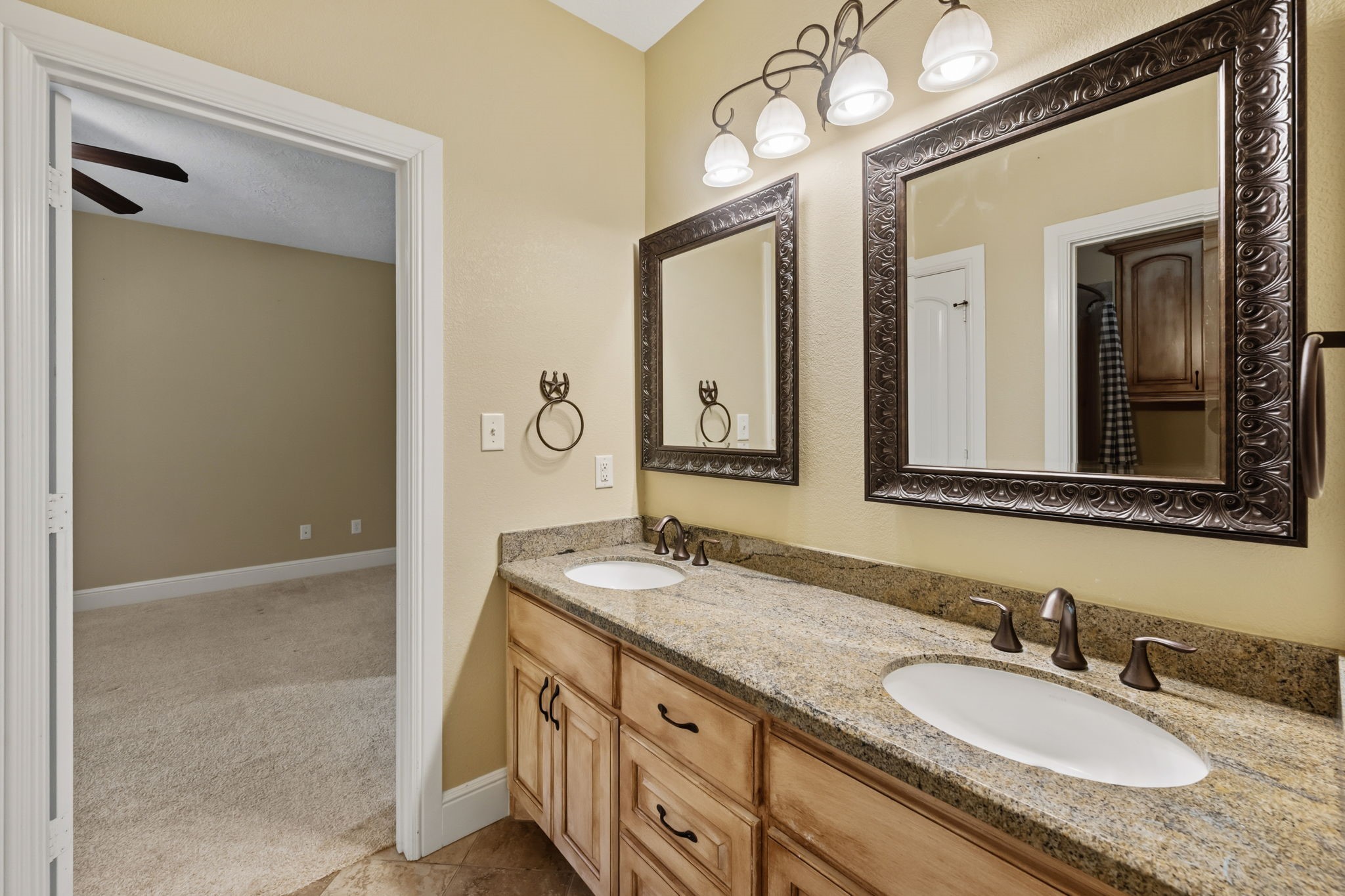 5041 Rimrock Pass Montgomery, TX 77316 - Photo 24 of 44 The 2nd and 3rd bedrooms, located downstairs share this bathroom with double sinks