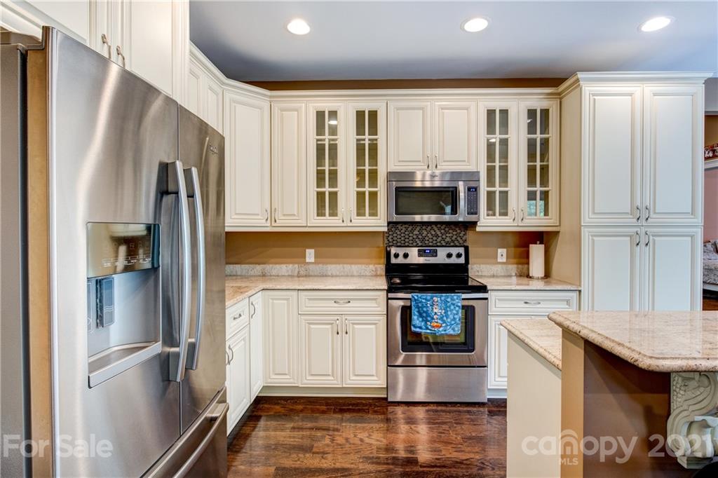 1637 State Rd S-46-1102, Unit 4 York, SC 29745 - Photo 16 of 39 a kitchen with stainless steel appliances granite countertop a refrigerator stove and sink