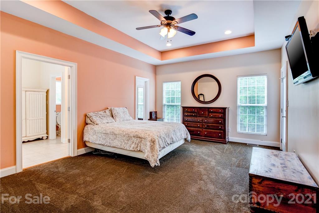 1637 State Rd S-46-1102, Unit 4 York, SC 29745 - Photo 17 of 39 a spacious bedroom with a bed a flat screen tv and dresser
