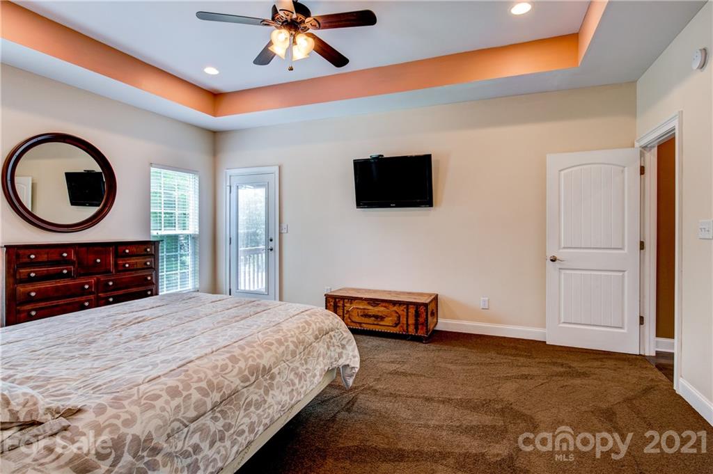 1637 State Rd S-46-1102, Unit 4 York, SC 29745 - Photo 19 of 39 a bedroom with a bed and a flat screen tv
