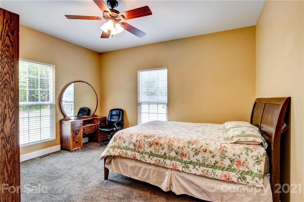 1637 State Rd S-46-1102, Unit 4 York, SC 29745 - Photo 23 of 39 a bedroom with a bed and a large window