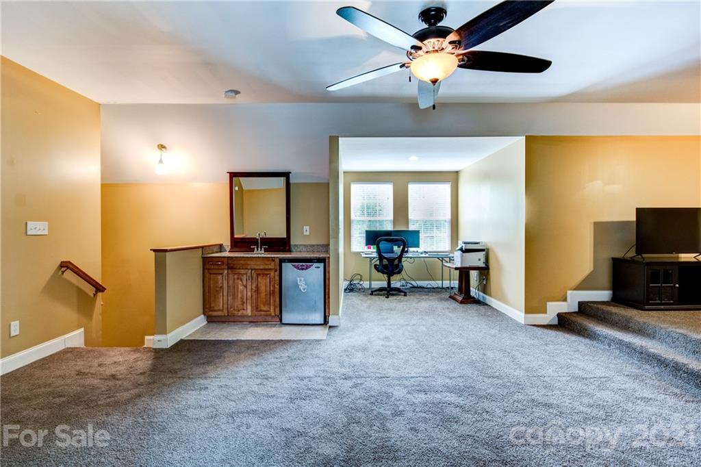 1637 State Rd S-46-1102, Unit 4 York, SC 29745 - Photo 27 of 39 a living room with furniture and a flat screen tv