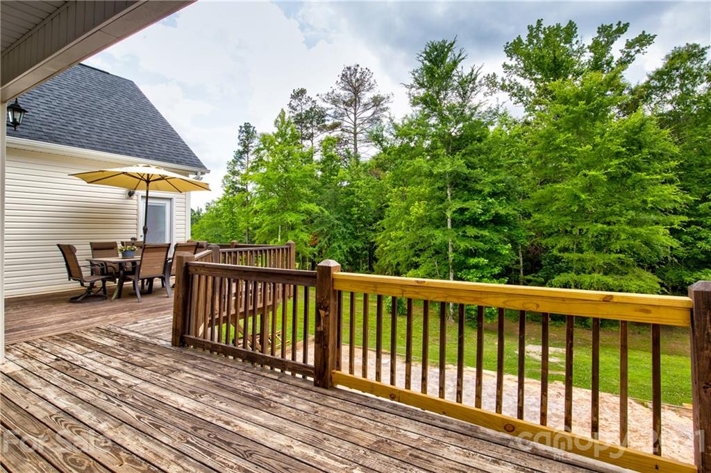 1637 State Rd S-46-1102, Unit 4 York, SC 29745 - Photo 28 of 39 a balcony with wooden floor and outdoor seating