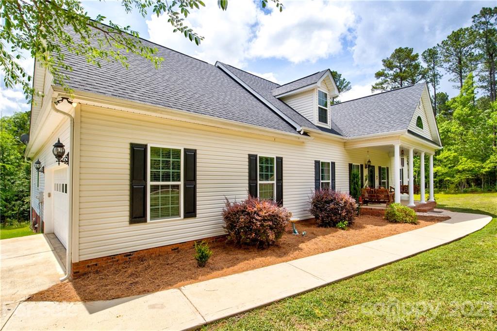 1637 State Rd S-46-1102, Unit 4 York, SC 29745 - Photo 4 of 39 a view of a house with backyard sitting area and porch