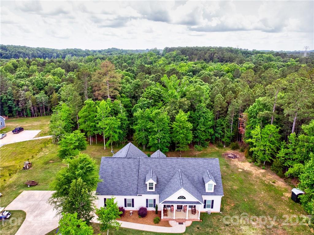 1637 State Rd S-46-1102, Unit 4 York, SC 29745 - Photo 34 of 39 an aerial view of residential houses with outdoor space and trees