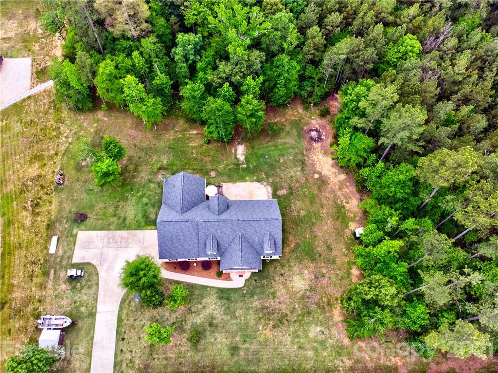 1637 State Rd S-46-1102, Unit 4 York, SC 29745 - Photo 35 of 39 a view of a yard with plants and a fountain