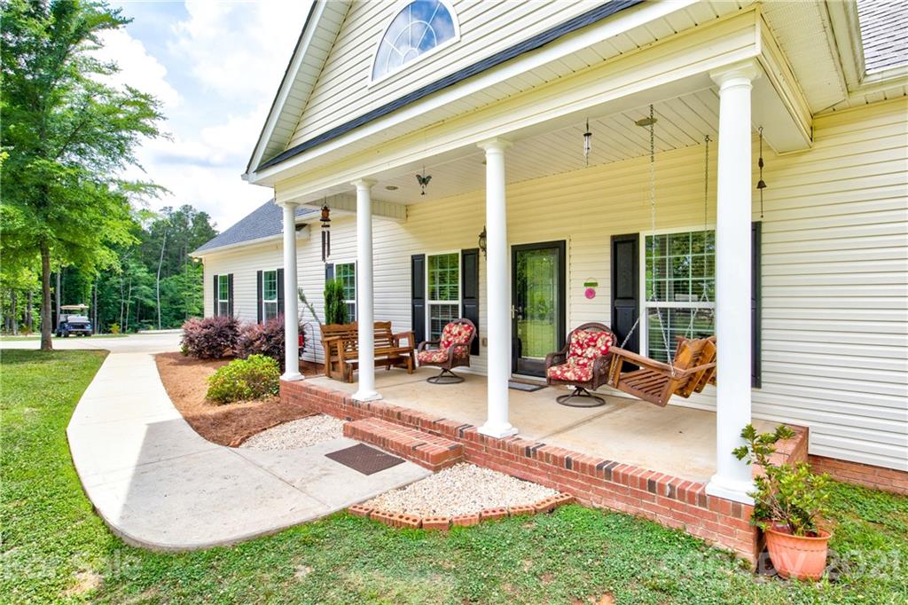 1637 State Rd S-46-1102, Unit 4 York, SC 29745 - Photo 6 of 39 a view of a house with backyard porch and sitting area