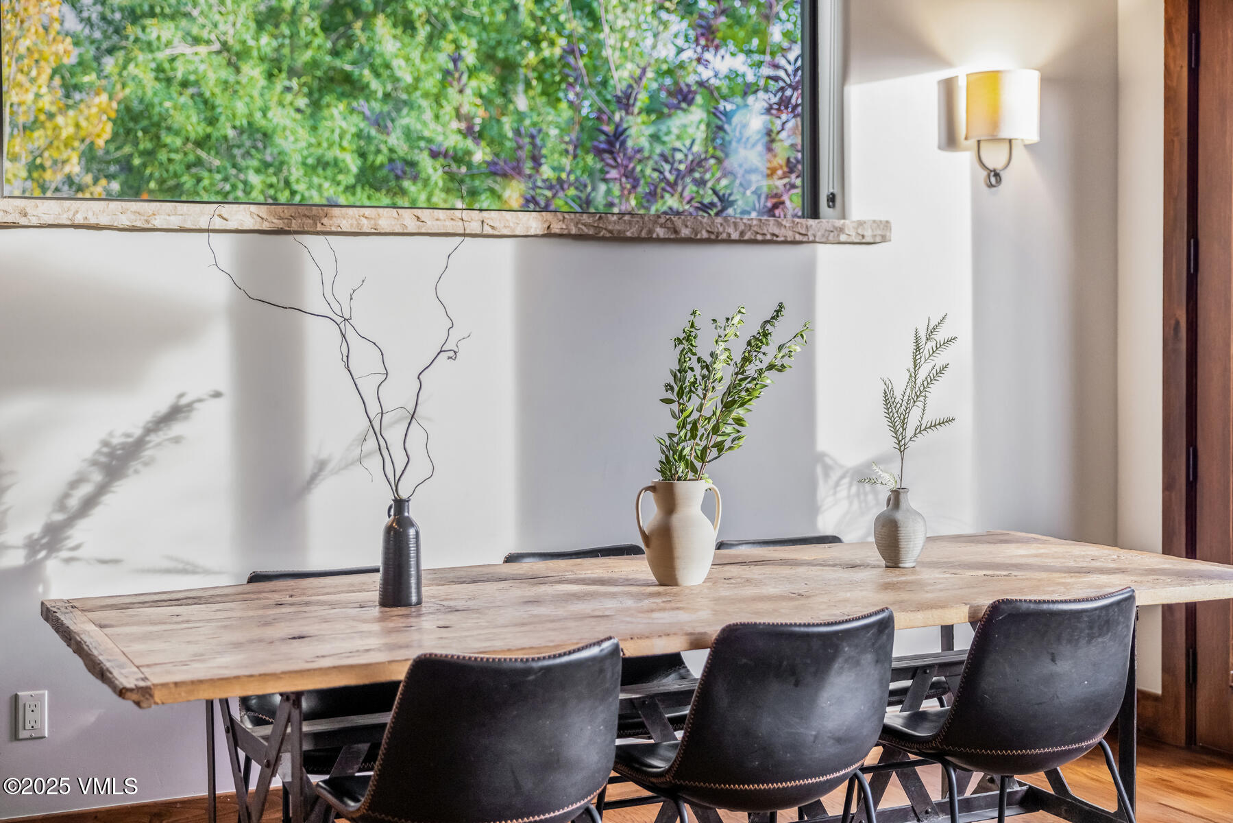 2310 Old Trail Road, Unit A Avon, CO 81620 - Photo 11 of 36 a dining room with furniture and wooden floor