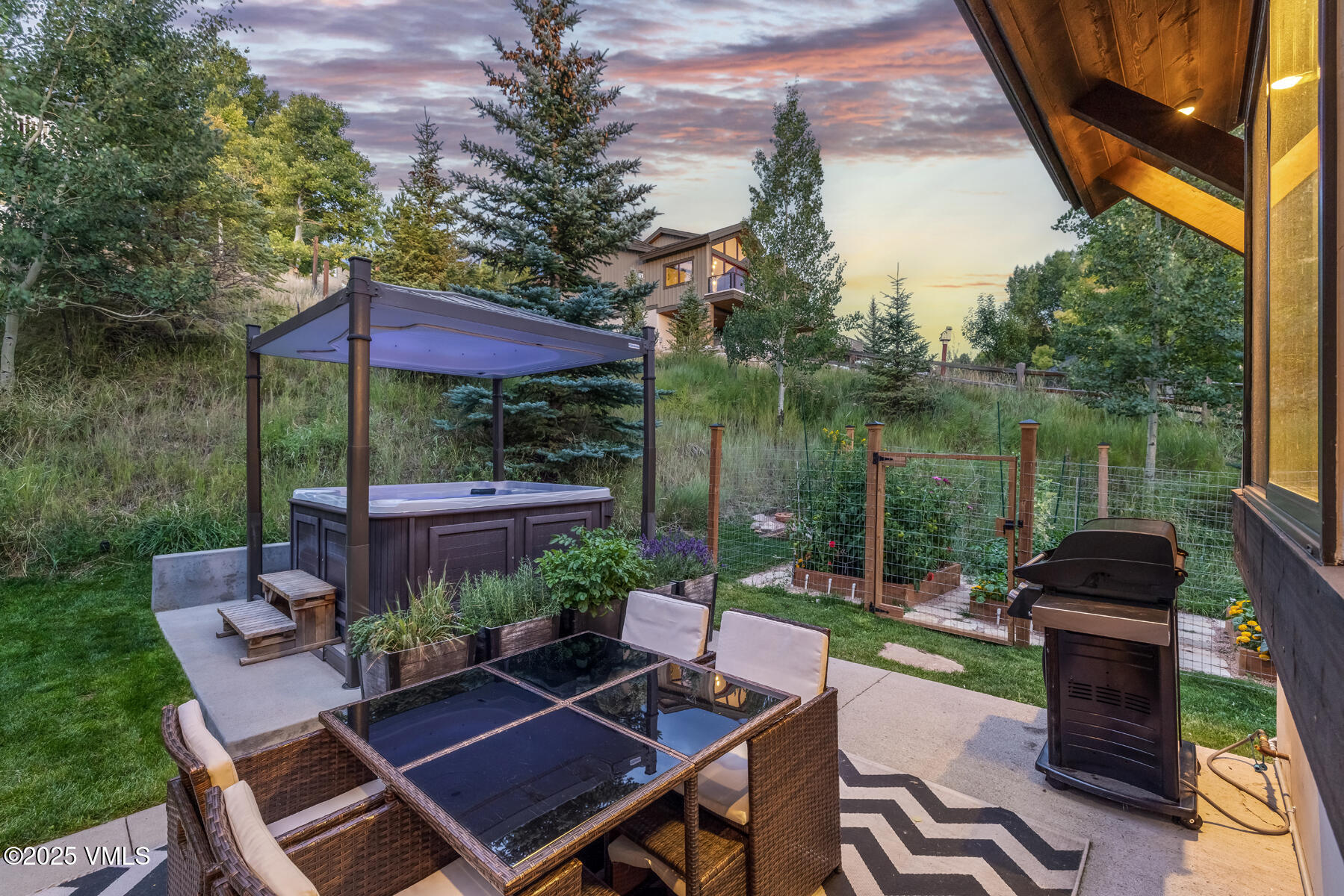 2310 Old Trail Road, Unit A Avon, CO 81620 - Photo 21 of 36 a view of a backyard with sitting area and furniture