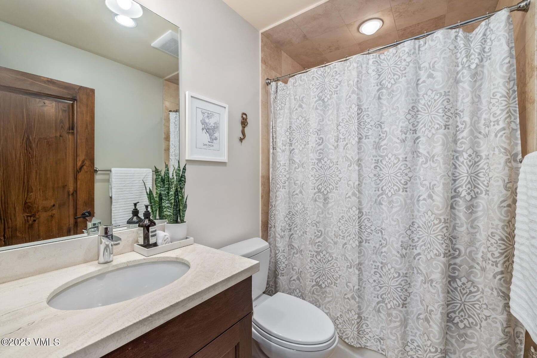 2310 Old Trail Road, Unit A Avon, CO 81620 - Photo 27 of 36 a bathroom with a sink toilet and shower