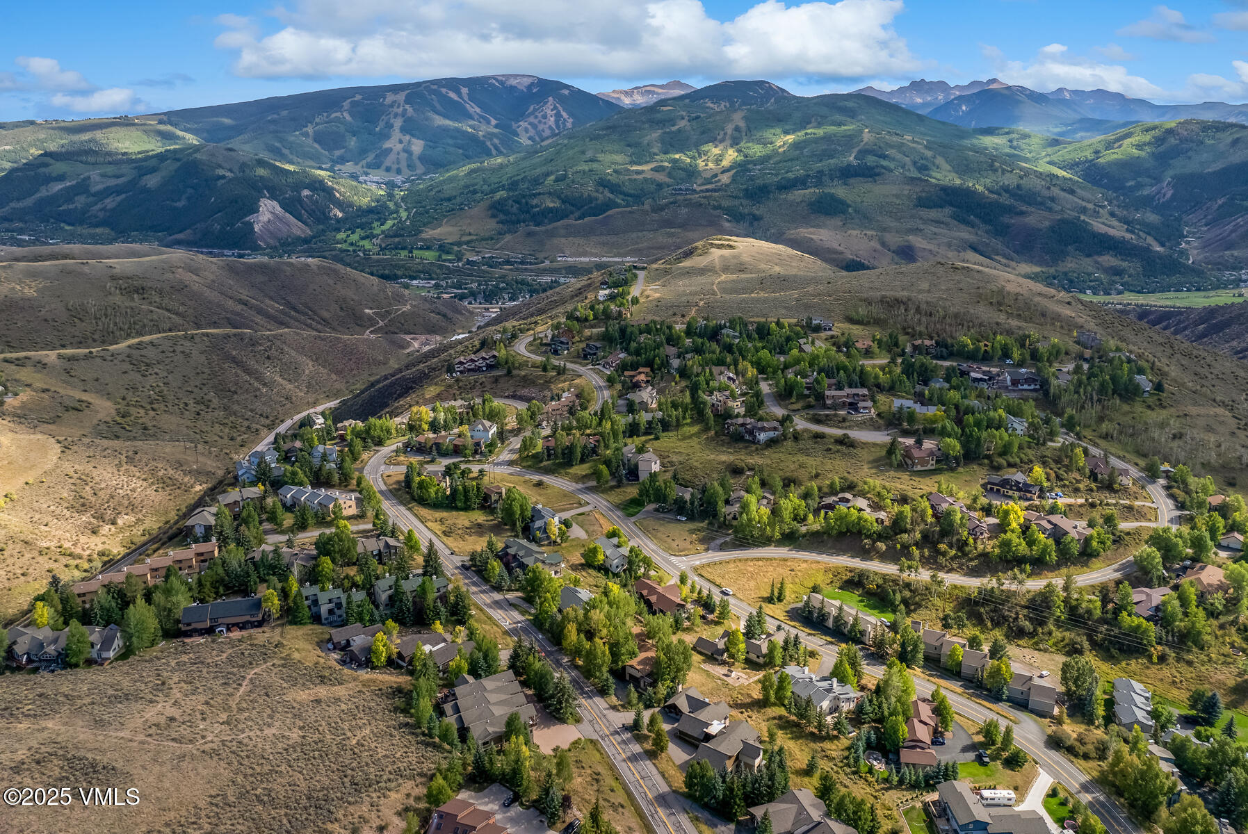 2310 Old Trail Road, Unit A Avon, CO 81620 - Photo 35 of 36 a view of a city with mountains in the background