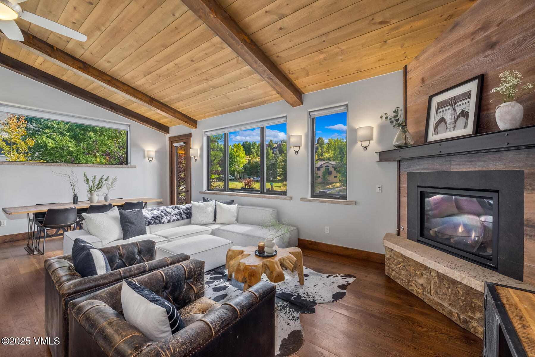 2310 Old Trail Road, Unit A Avon, CO 81620 - Photo 4 of 36 a living room with furniture fireplace and a large window
