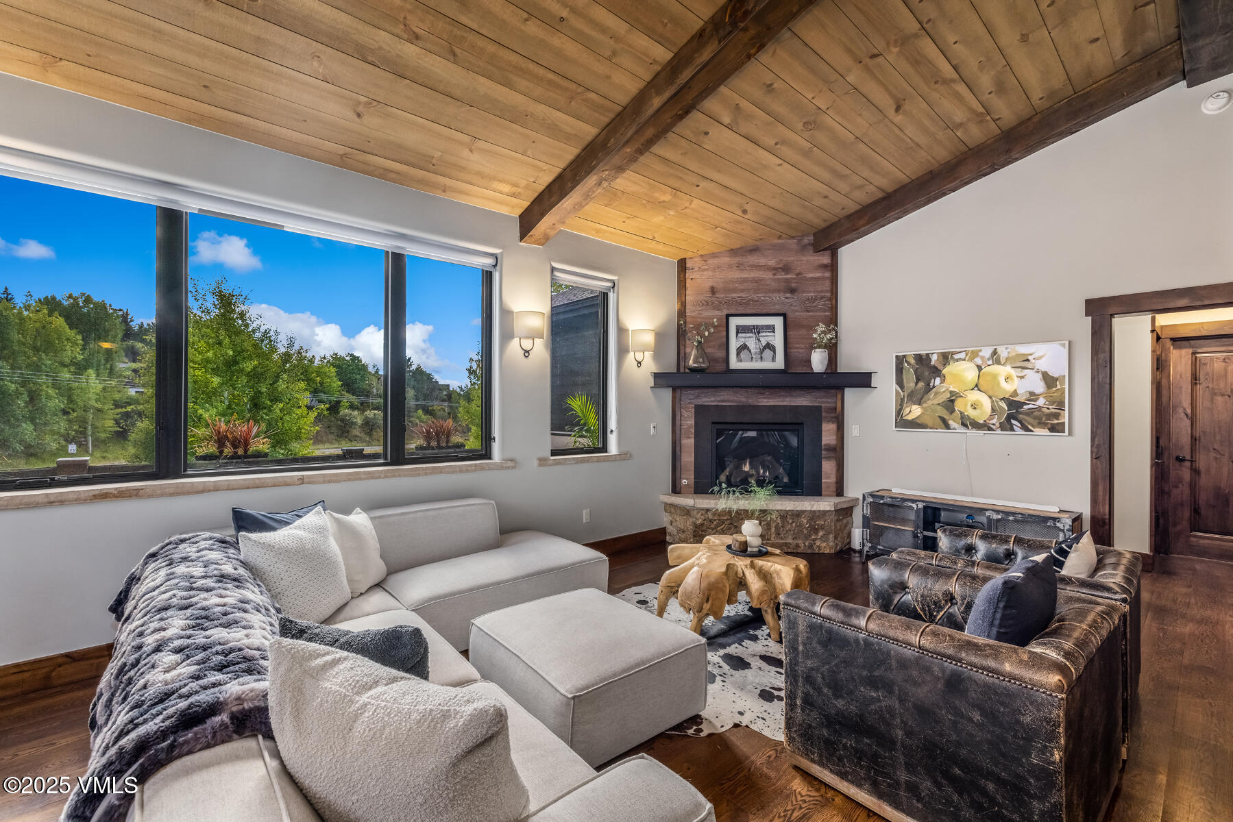 2310 Old Trail Road, Unit A Avon, CO 81620 - Photo 5 of 36 a living room with furniture fireplace and a large window