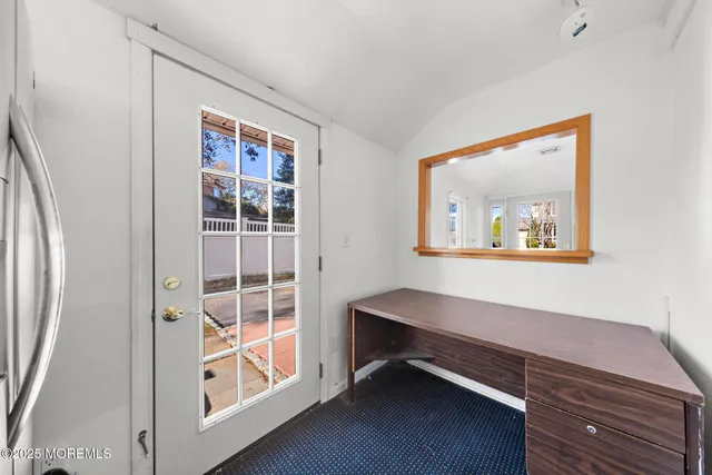 a room with chair and a window