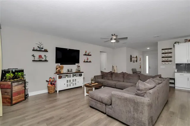 a living room with furniture white walls and white walls