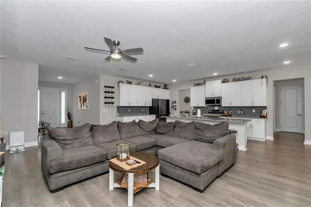 a view of a room with furniture window and wooden floor