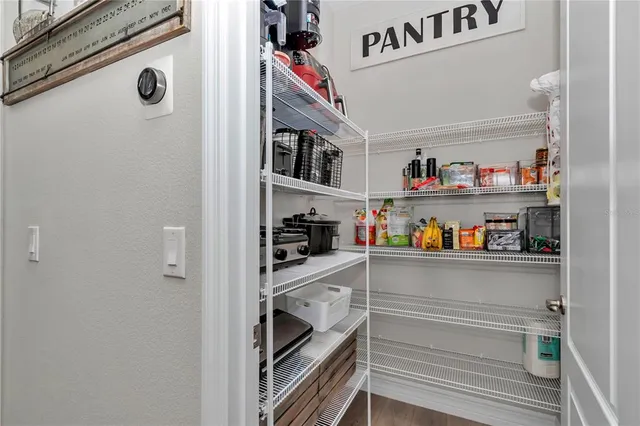 a hotel room with a bed and a flat screen tv