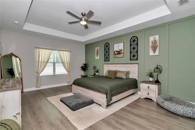a bathroom with a granite countertop sink a mirror and a shower