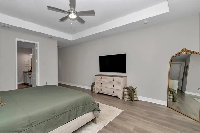 a bathroom with a granite countertop double vanity sink and a large mirror