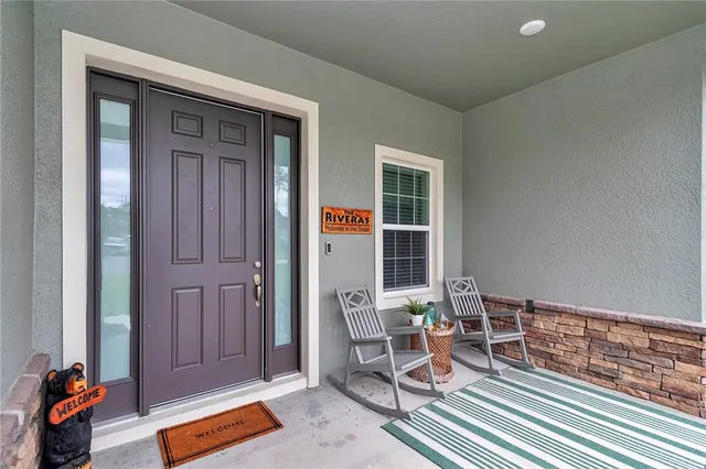 a front view of a house with a garden and porch