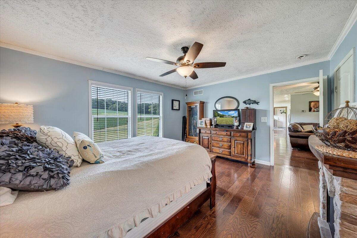 988 Timber Line Road Ferrum, VA 24088 - Photo 16 of 34 a bedroom with a large bed and a large window