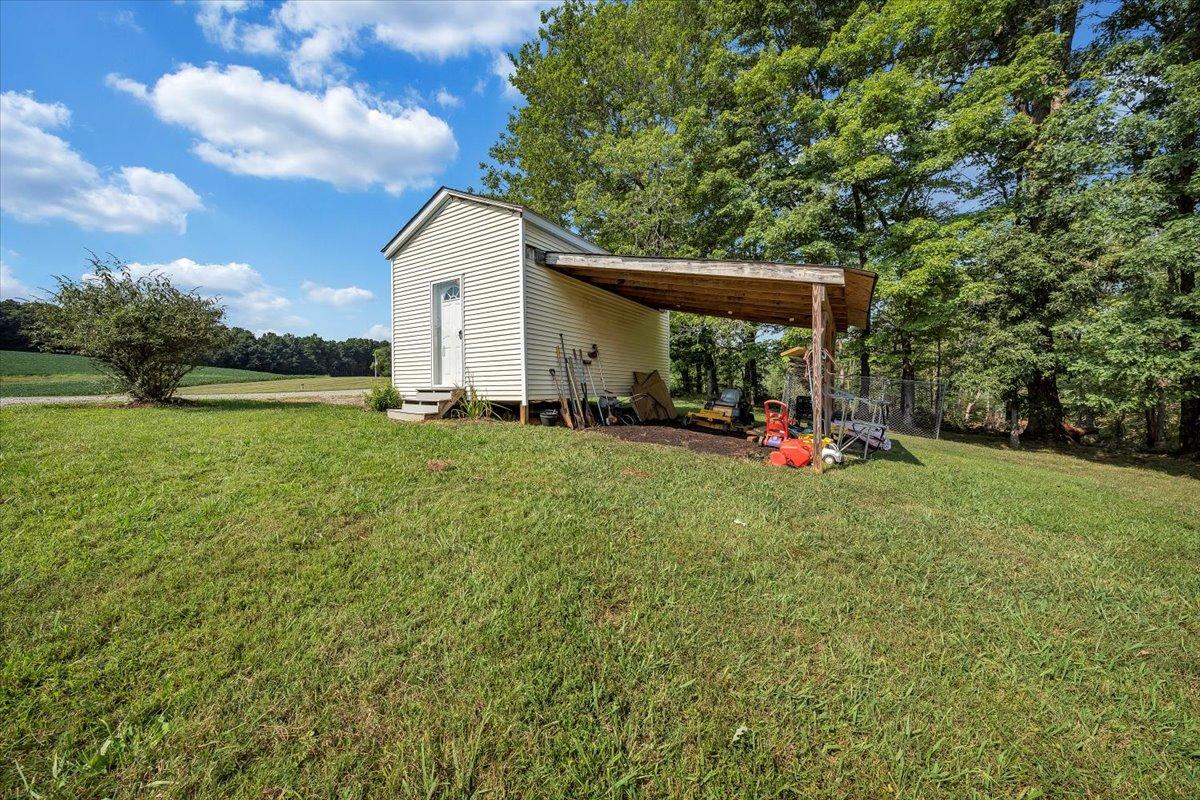 988 Timber Line Road Ferrum, VA 24088 - Photo 22 of 34 a backyard of a house with table and chairs
