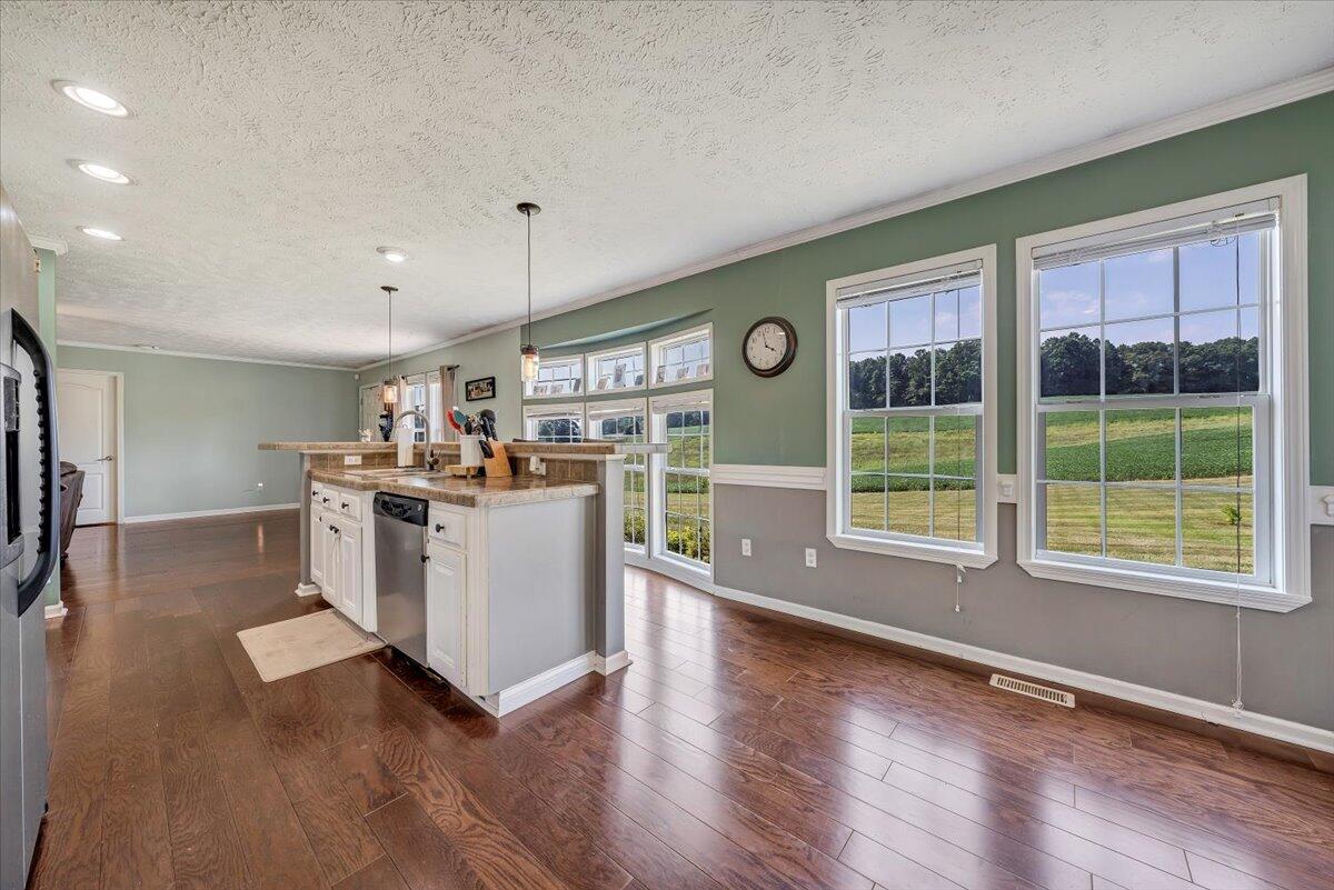 988 Timber Line Road Ferrum, VA 24088 - Photo 10 of 34 a view of a kitchen with wooden floor and electronic appliances