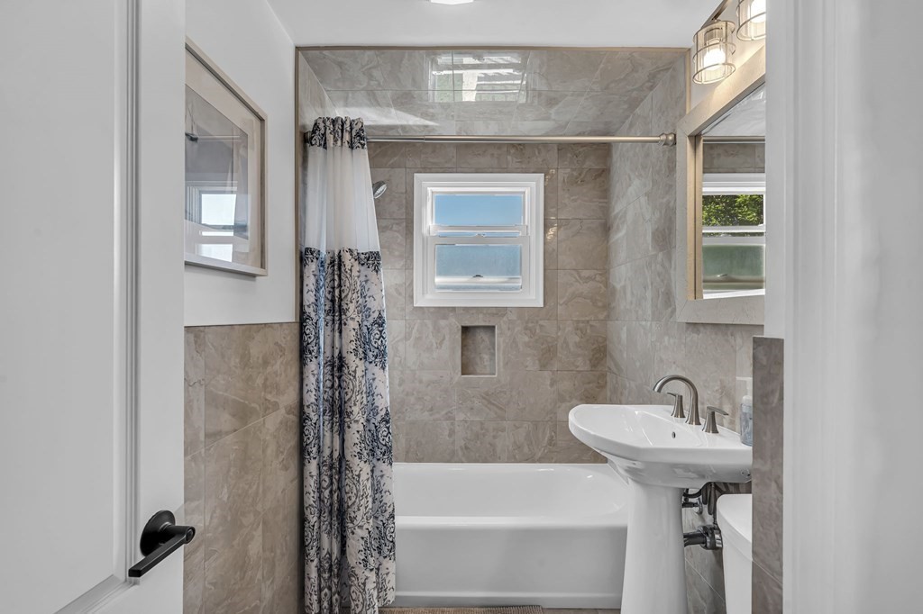 39 Rita Street Springfield, MA 01118 - Photo 17 of 42 a bathroom with a sink and shower