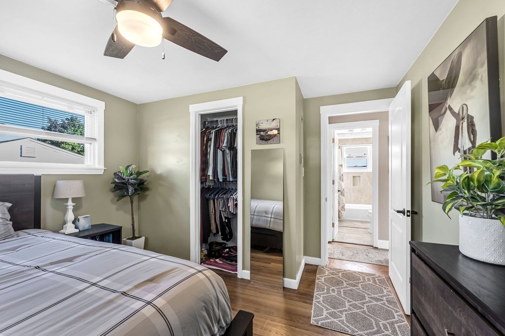 39 Rita Street Springfield, MA 01118 - Photo 20 of 42 a bedroom with a bed and a potted plant