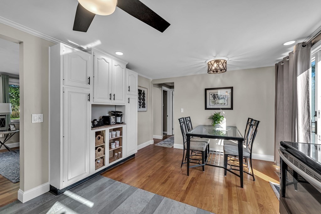 39 Rita Street Springfield, MA 01118 - Photo 9 of 42 a view of a dining room with furniture and wooden floor