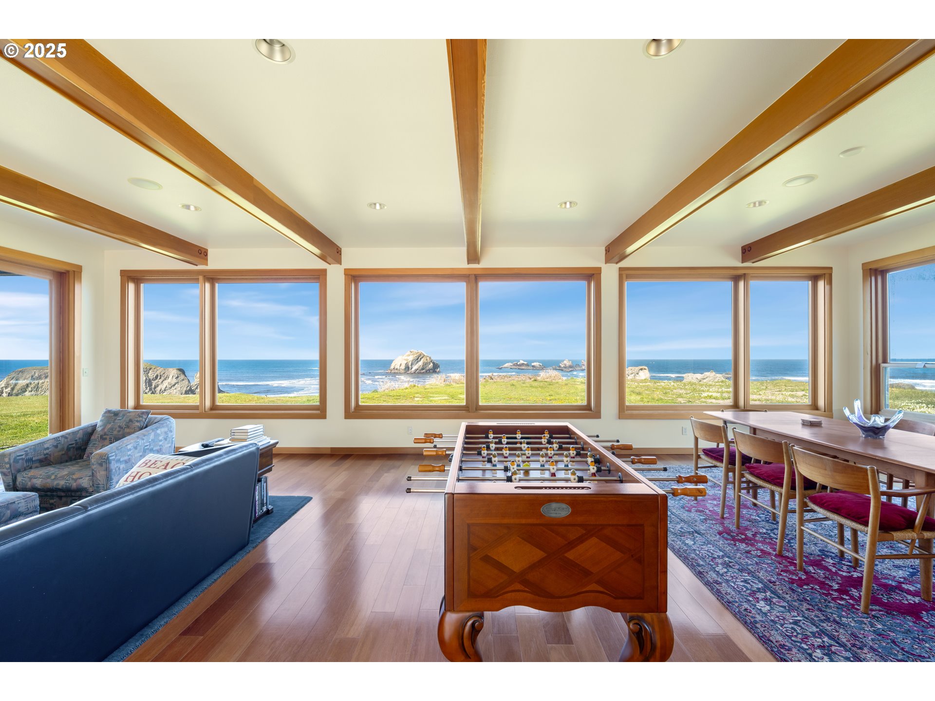 1950 Beach Loop Road Bandon, OR 97411 - Photo 22 of 45 a living room with furniture a large window with wooden floor