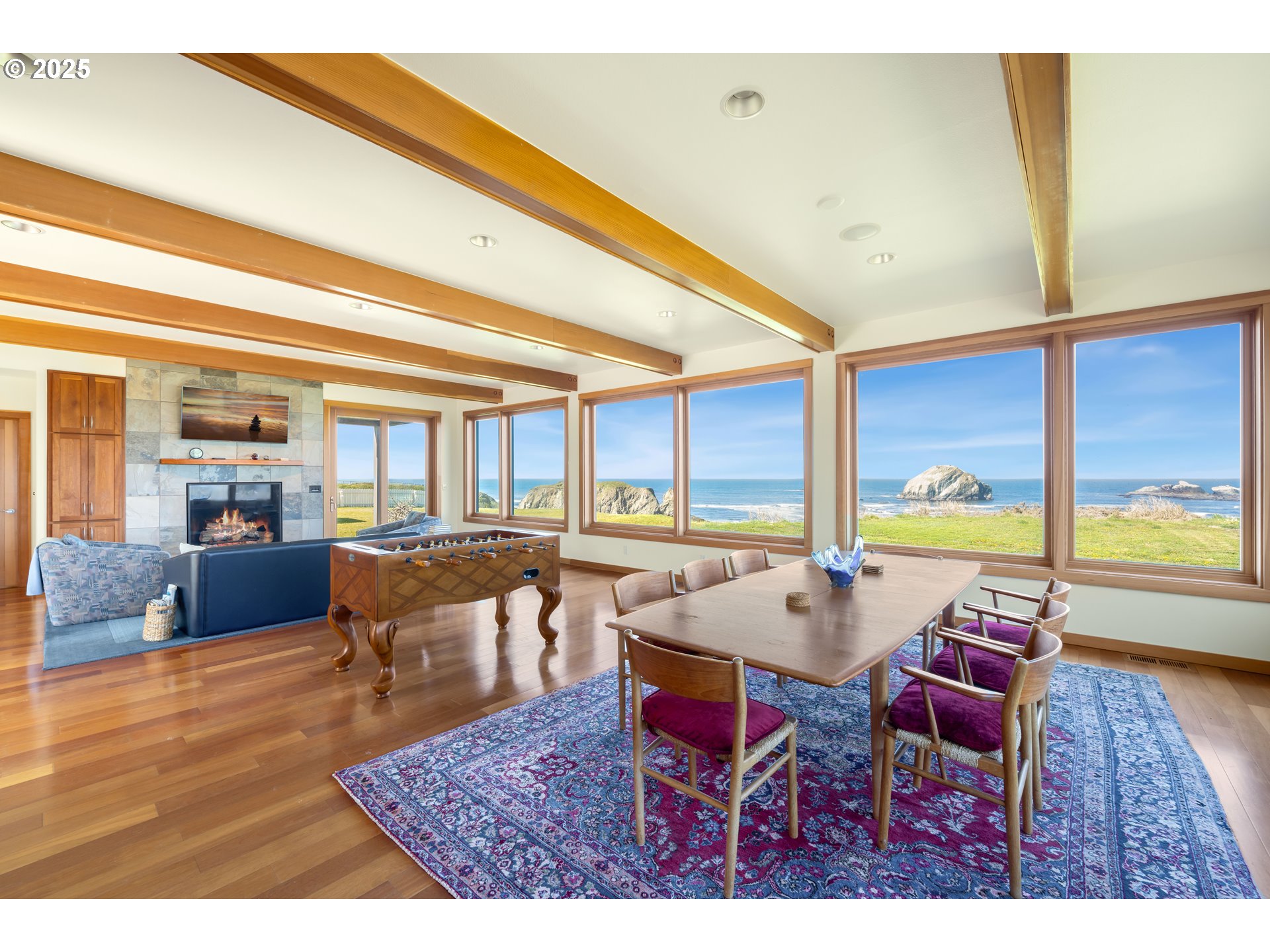 1950 Beach Loop Road Bandon, OR 97411 - Photo 23 of 45 a view of a dining room with furniture large windows and wooden floor