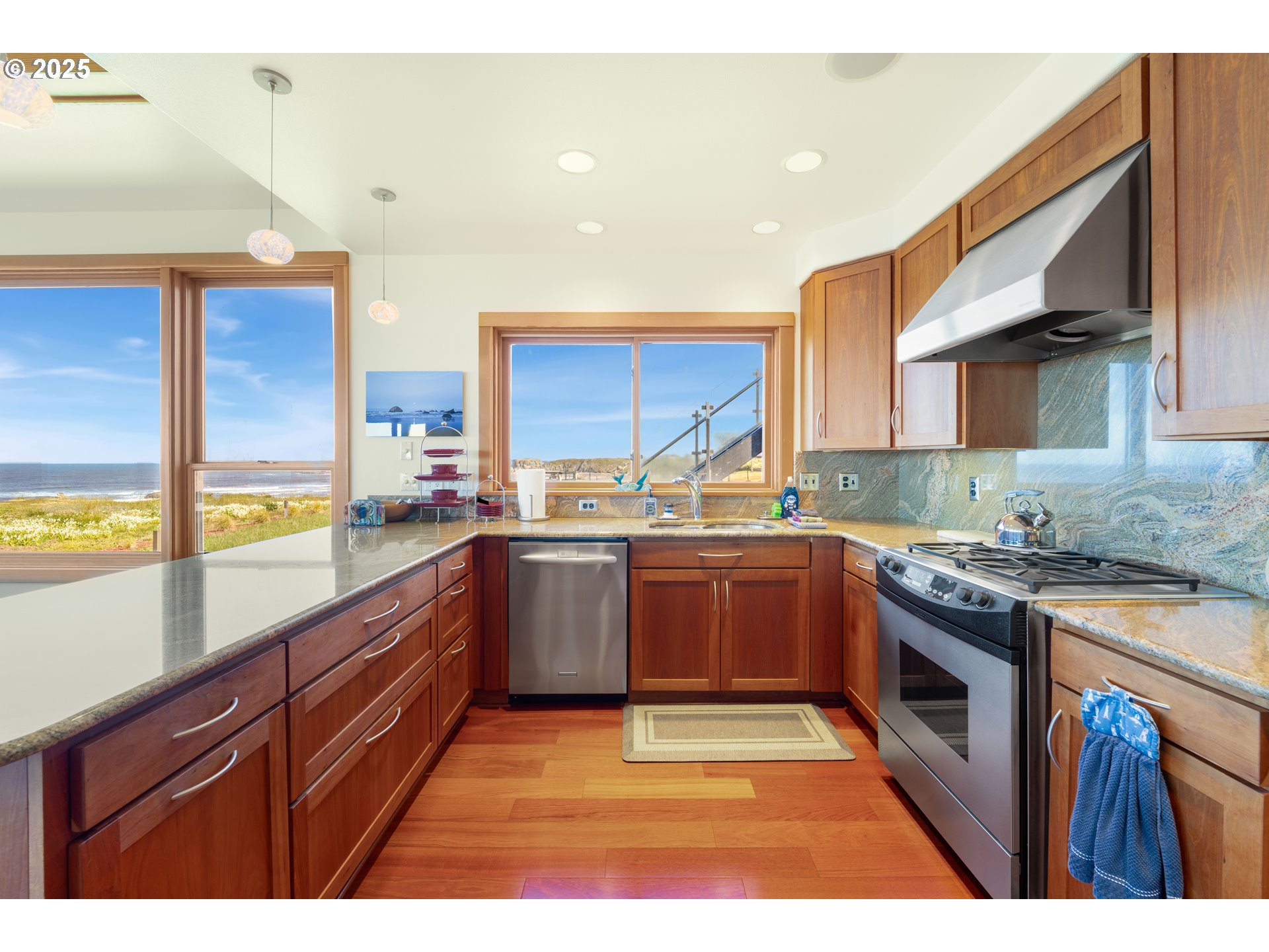 1950 Beach Loop Road Bandon, OR 97411 - Photo 28 of 45 a kitchen with stainless steel appliances granite countertop a stove a sink and a microwave