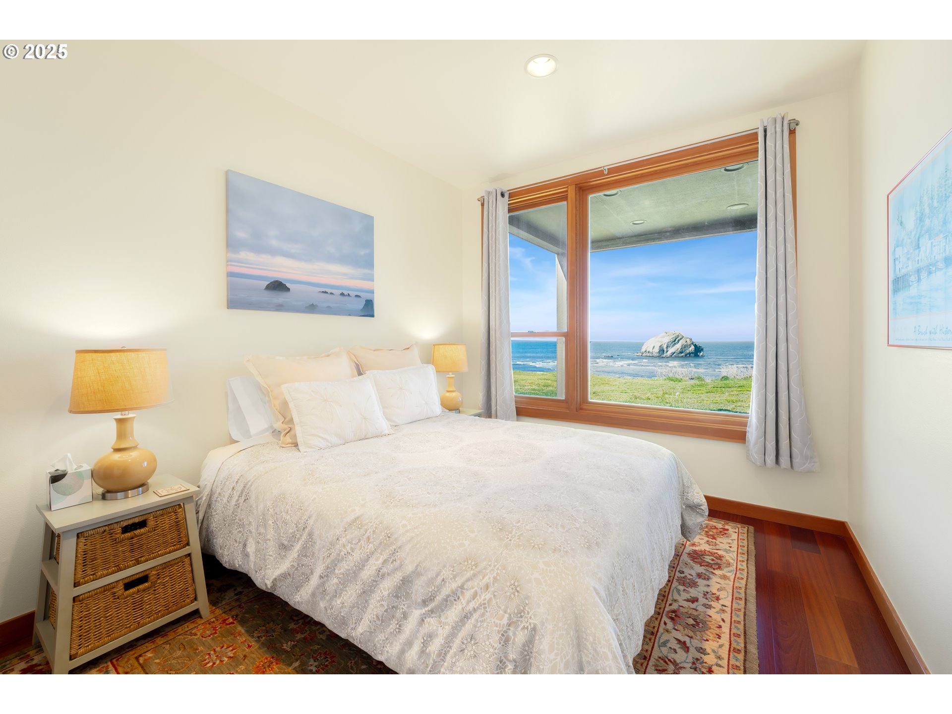 1950 Beach Loop Road Bandon, OR 97411 - Photo 33 of 45 a bedroom with a bed and a night stand