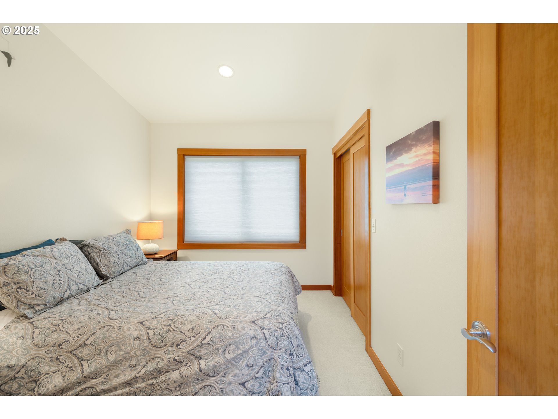 1950 Beach Loop Road Bandon, OR 97411 - Photo 35 of 45 a bedroom with a bed and a painting