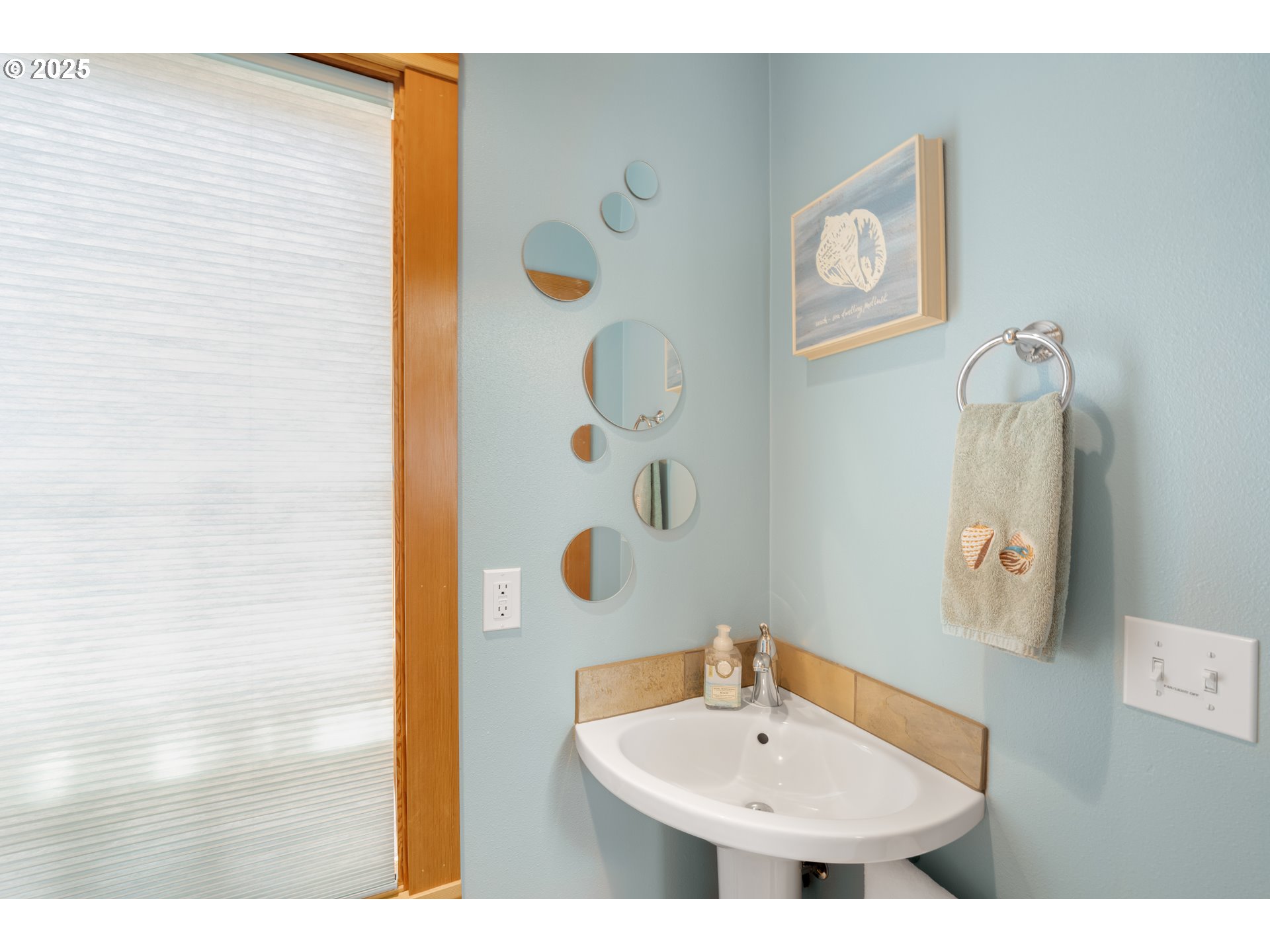 1950 Beach Loop Road Bandon, OR 97411 - Photo 45 of 45 a bathroom with a sink and a mirror