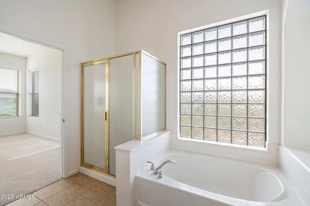 a view of an empty room with a kitchen
