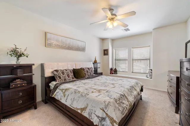 a en suite bathroom with a sink and a mirror