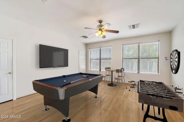 a view of a chair and table in the backyard