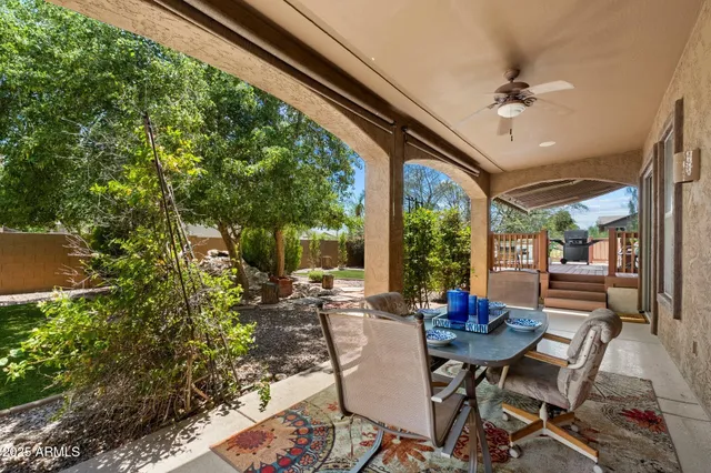 a view of balcony with chairs and potted plants