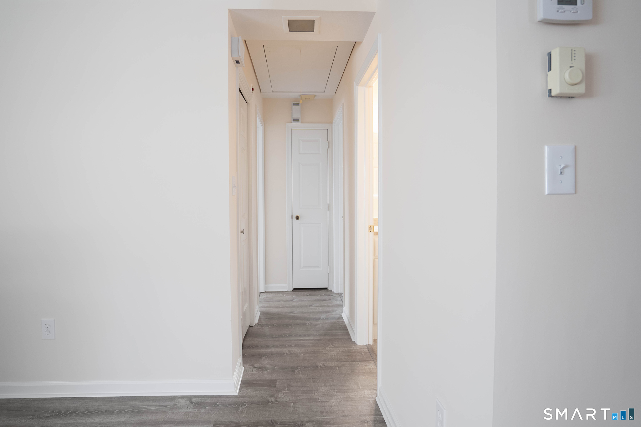 4 Currycross Road, Unit 4 Madison, CT 06443 - Photo 13 of 30 a view of a hallway with wooden floor