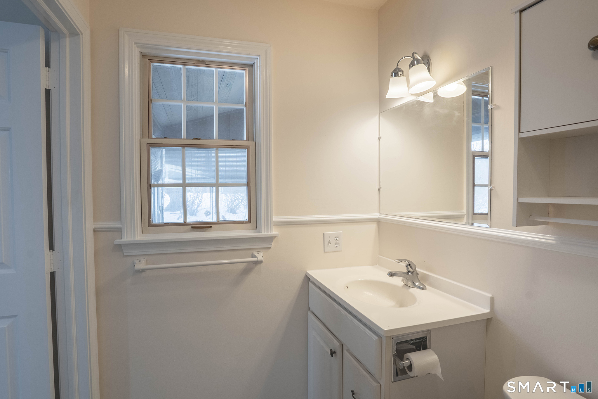 4 Currycross Road, Unit 4 Madison, CT 06443 - Photo 19 of 30 a bathroom with a sink vanity and a mirror