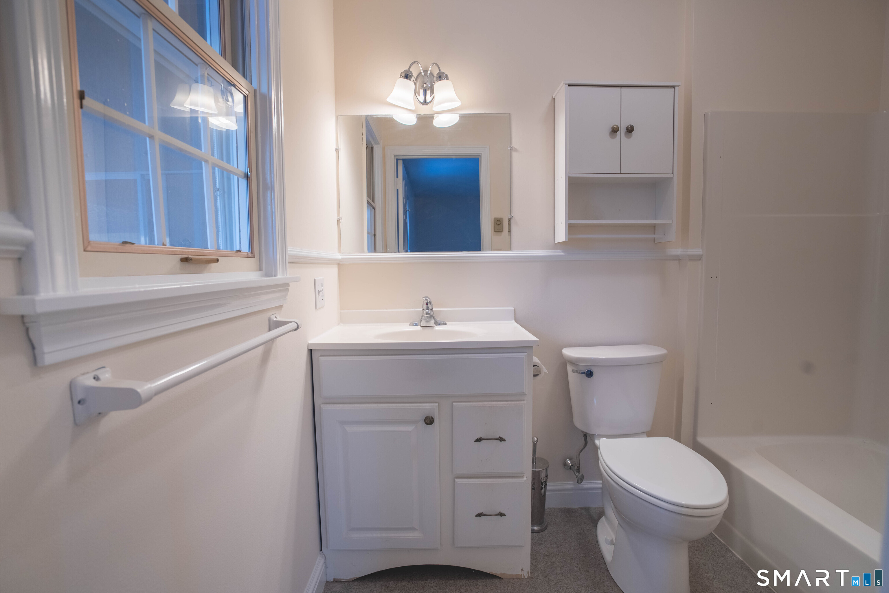 4 Currycross Road, Unit 4 Madison, CT 06443 - Photo 20 of 30 a bathroom with a toilet sink and mirror